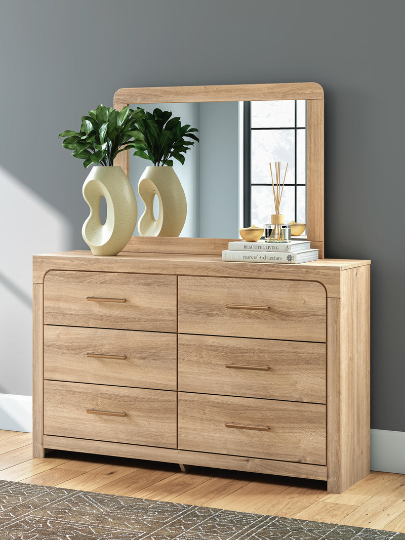 Ashley Furniture Kinlanni bedroom set with a bed, dresser, and nightstands in a modern bedroom setup.