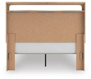Ashley Furniture Kinlanni bedroom set featuring a bed frame, nightstands, and dresser in a modern bedroom design.