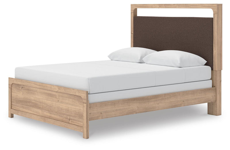 Ashley Furniture Kinlanni bedroom set featuring a modern bed frame with a headboard and matching nightstands, seen from an angled view.