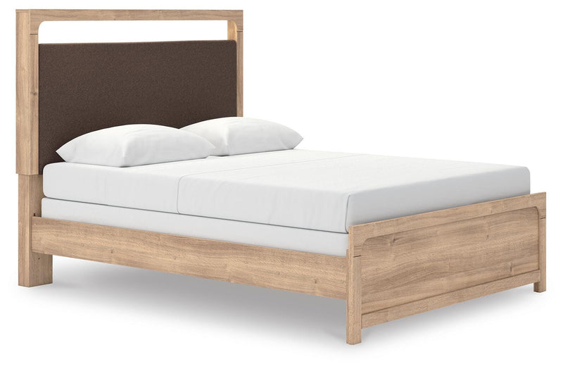 Ashley Furniture Kinlanni bedroom set showing a stylish bed with a headboard, nightstands, and matching decor in a well-lit room.