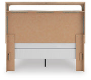 Ashley Furniture Kinlanni bedroom set with a bed, matching nightstands, and a dresser in a modern bedroom setting.