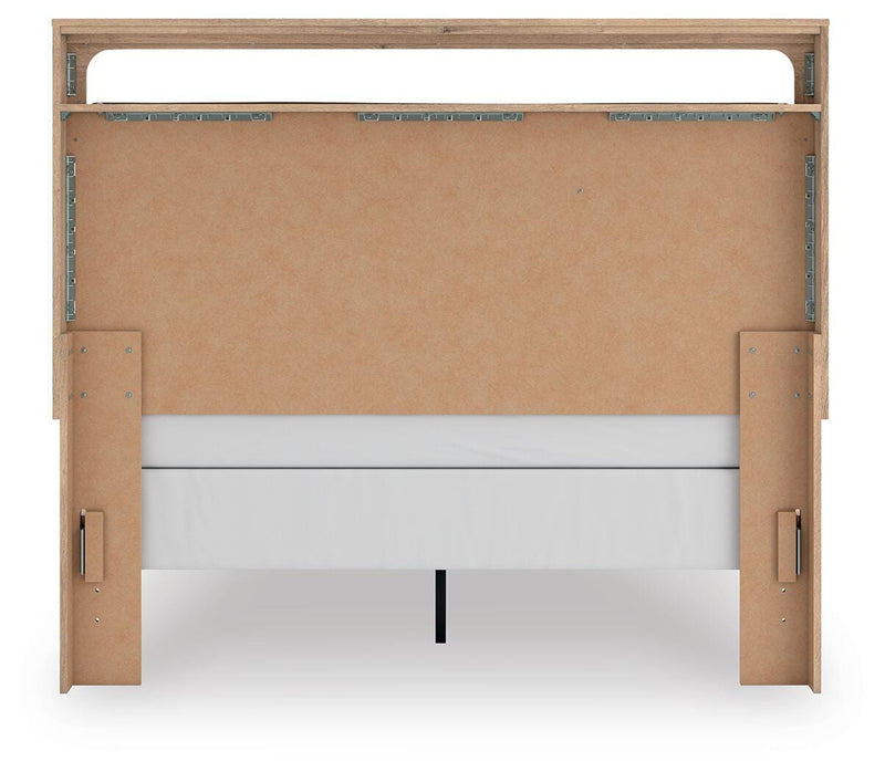 Ashley Furniture Kinlanni bedroom set with a bed, matching nightstands, and a dresser in a modern bedroom setting.
