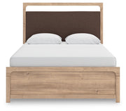 Ashley Furniture Kinlanni bedroom set featuring a modern bed frame with a plush upholstered headboard and matching side tables.