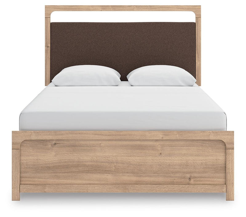 Ashley Furniture Kinlanni bedroom set featuring a modern bed frame with a plush upholstered headboard and matching side tables.