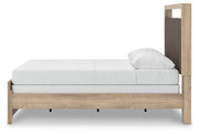 Ashley Furniture Kinlanni bedroom set featuring a bed, matching nightstands, and dresser with elegant wood finish and modern design.