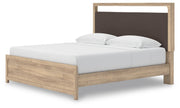 Ashley Furniture Kinlanni bedroom set featuring a bed with a padded headboard, matching nightstands, and a modern design.