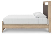 Ashley Furniture Kinlanni bedroom set featuring a modern bed frame, matching nightstands, and a stylish dresser in a cozy bedroom.