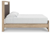 Ashley Furniture Kinlanni bedroom set with a modern bed frame, matching nightstands, and coordinated bedroom furniture in a stylish bedroom.