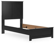 Ashley Furniture Maribel Bed with neutral-colored upholstered headboard and wooden frame, shown from a side angle.