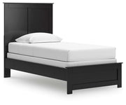Ashley Furniture Maribel Bed with elegant wooden frame and upholstered headboard, shown from a side angle.