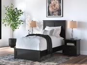 Ashley Furniture Maribel Bed with a sleek wooden frame and upholstered headboard, shown in a stylish bedroom setting.