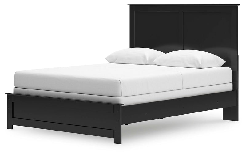 Ashley Furniture Maribel Bed with a stylish upholstered headboard and wooden frame, shown from an angled side view.