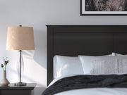 Ashley Furniture Maribel Bed with detailed wood finish and elegant design, showcasing a stylish and comfortable bedroom centerpiece.