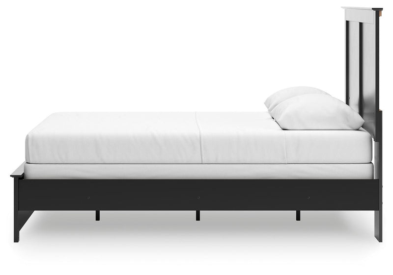 Ashley Furniture Maribel Bed with a sleek wood finish and modern design, shown in a cozy bedroom setting.