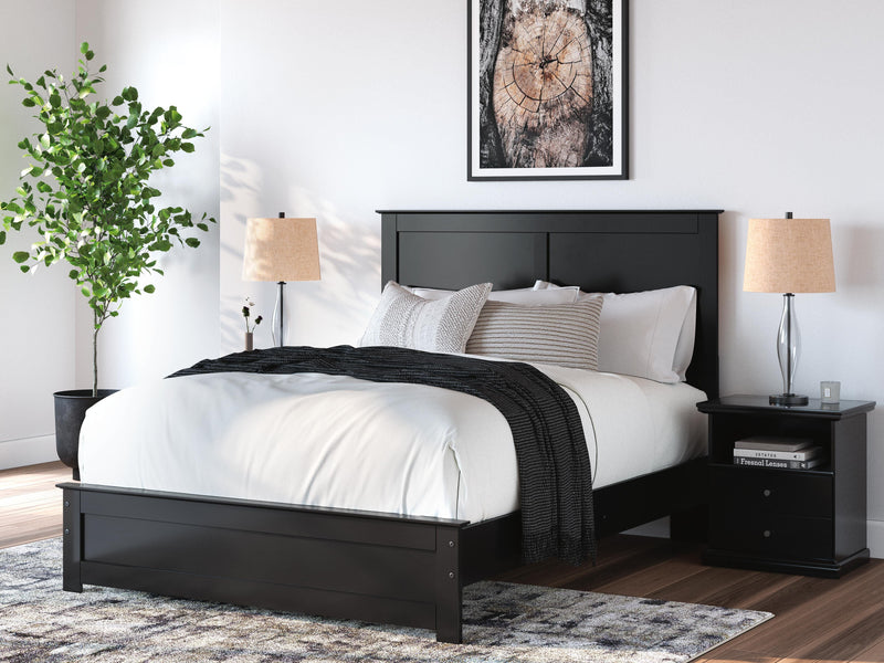 Ashley Furniture Maribel Bed with elegant wooden frame and upholstered headboard, showcased in a stylish bedroom setting.