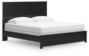 Ashley Furniture Maribel Bed with elegant upholstered headboard and wooden frame, shown from an angled side view.
