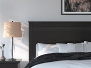 Ashley Furniture Maribel Bed with detailed wood finish and elegant design, showcasing the headboard and frame details.