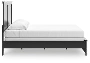 Ashley Furniture Maribel Bed with elegant wood frame and detailed headboard, shown from a side view in the image.