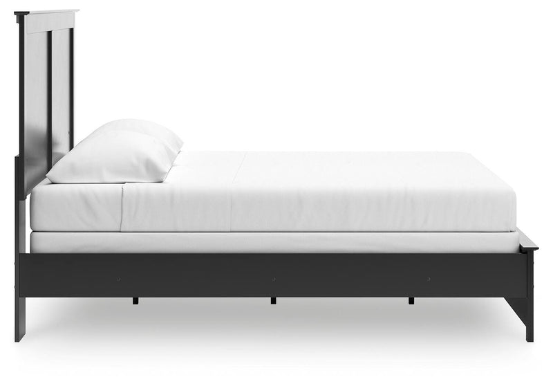 Ashley Furniture Maribel Bed with elegant wood frame and detailed headboard, shown from a side view in the image.