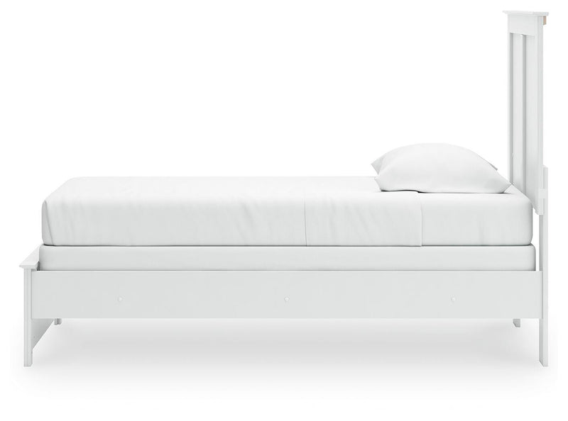 Ashley Furniture Bostwick Shoals bed with a classic wooden frame and neutral finish, shown from a side angle.