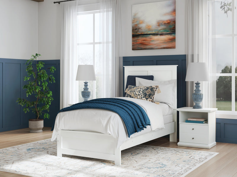 Ashley Furniture Bostwick Shoals Bed with wooden frame and upholstered headboard in a modern bedroom setting.