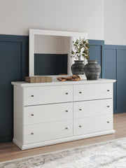 Ashley Furniture Bostwick Shoals bedroom set featuring a bed frame, matching nightstands, and a dresser in a modern design.