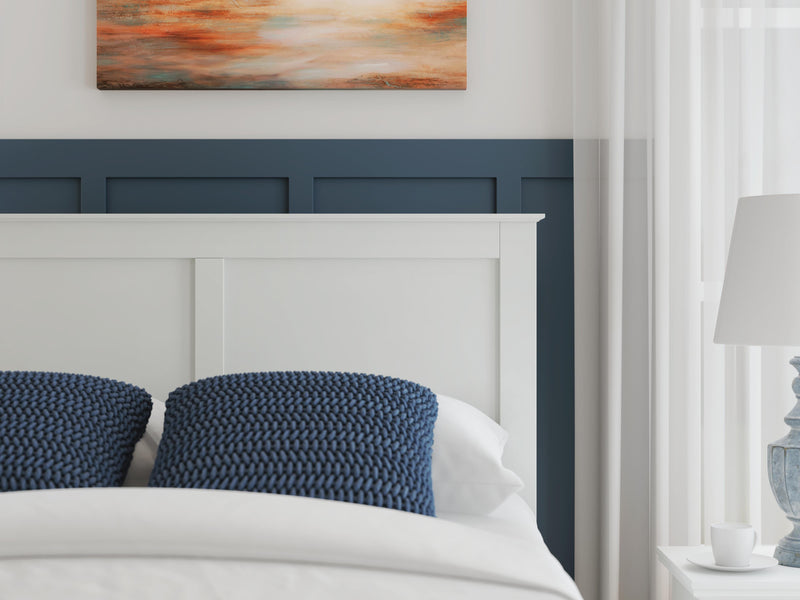 Ashley Furniture Bostwick Shoals bedroom set, showing a detailed view of the bed frame with upholstered headboard and matching furniture.