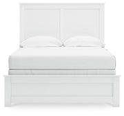 Ashley Furniture Bostwick Shoals bedroom set featuring a headboard with upholstered details and coordinating nightstands.