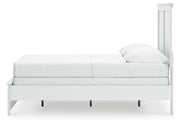 Ashley Furniture Bostwick Shoals bed with a dark wood finish and classic design, shown from a side angle.