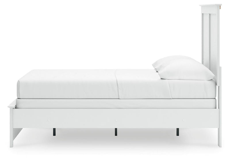 Ashley Furniture Bostwick Shoals bedroom set with matching bed frame, dresser, and nightstands in a modern bedroom setting.