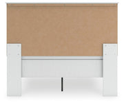 Ashley Furniture Bostwick Shoals bedroom set with a bed frame, nightstands, and matching dresser in a modern bedroom design.