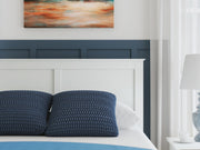 Ashley Furniture Bostwick Shoals bedroom set with a bed frame, nightstands, and dresser in a modern, stylish bedroom design.