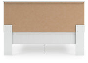 Ashley Furniture Bostwick Shoals bedroom set featuring a bed frame, nightstands, and dresser in a modern bedroom design.