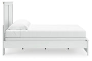 Ashley Furniture Bostwick Shoals bed with a wooden frame and neutral-toned upholstery, shown from a side view.