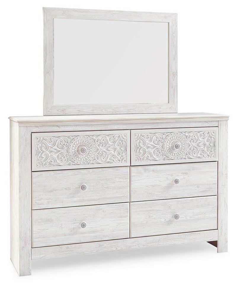 Ashley Furniture Paxberry youth bedroom set with bed, dresser, and nightstand in a modern design, shown from a side angle.