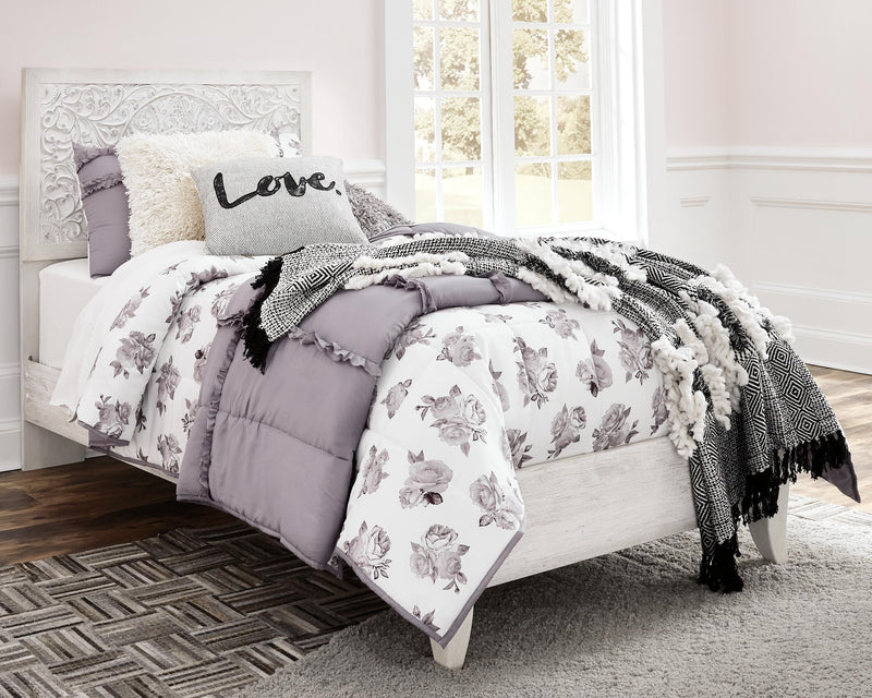Ashley Furniture Paxberry youth bedroom set featuring a bed with a headboard and matching furniture in a cozy bedroom setting.