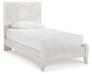Ashley Furniture Paxberry youth bedroom set featuring a bed, nightstand, and dresser in a modern wood finish, angled view.