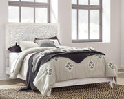 Ashley Furniture Paxberry youth bedroom set featuring a bed, dresser, and nightstand with a rustic wood finish.