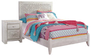 Ashley Furniture Paxberry youth bedroom set with a bed, dresser, and nightstand in a modern design, shown in a cozy bedroom setting.