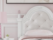 Ashley Furniture Kozlani upholstered bed with a padded headboard and neutral fabric, showcasing its elegant design and craftsmanship.