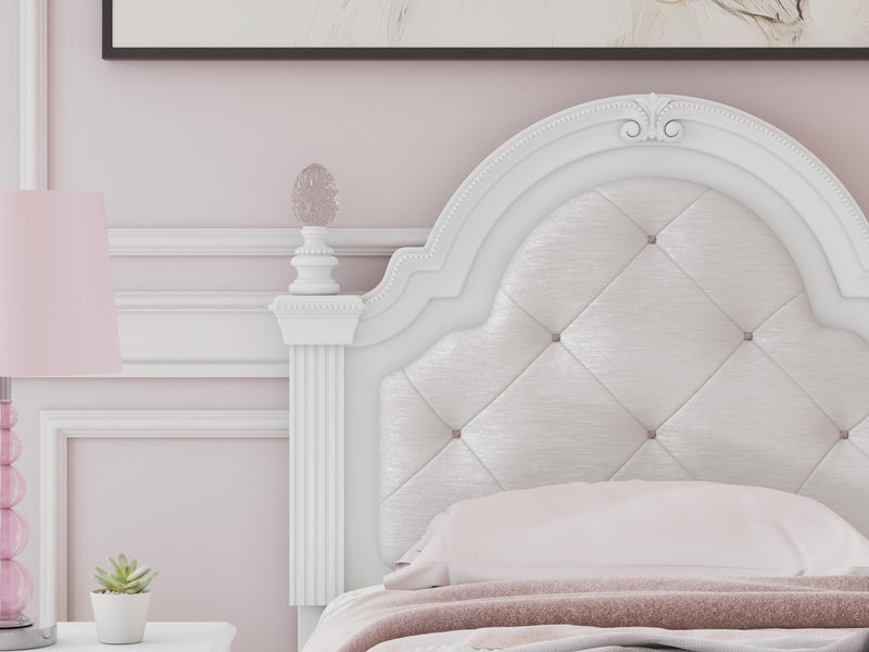 Ashley Furniture Kozlani upholstered bed with a padded headboard and neutral fabric, showcasing its elegant design and craftsmanship.