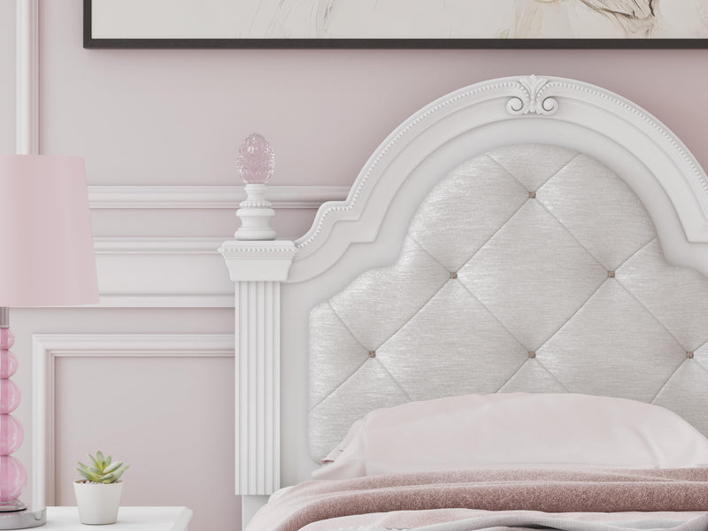 Ashley Furniture Kozlani upholstered bed with plush fabric and tufted headboard, shown in a stylish bedroom setting.