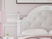 Ashley Furniture Kozlani upholstered bed with a padded headboard and neutral fabric, shown in a detailed close-up image.