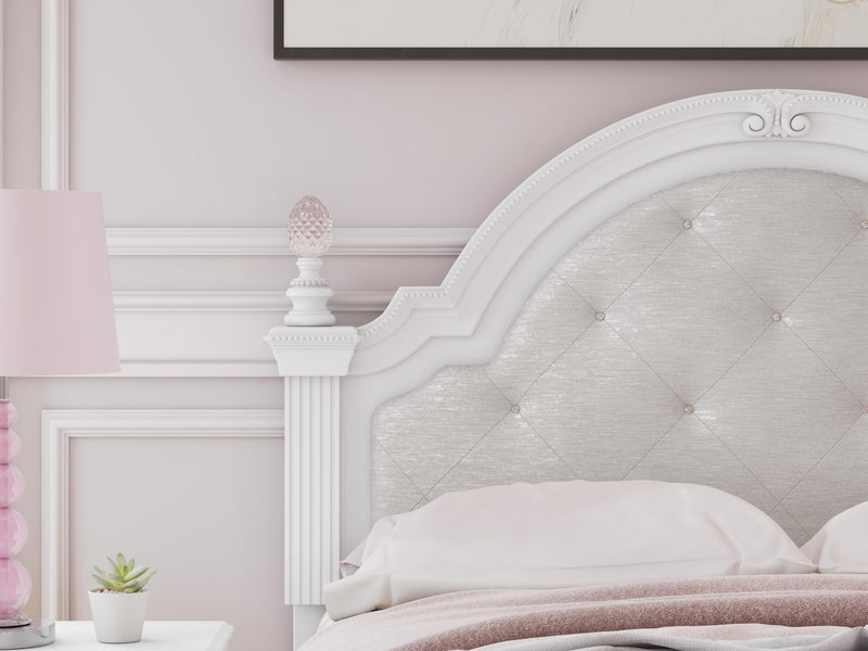 Ashley Furniture Kozlani upholstered bed with a padded headboard and neutral fabric, shown in a detailed close-up image.