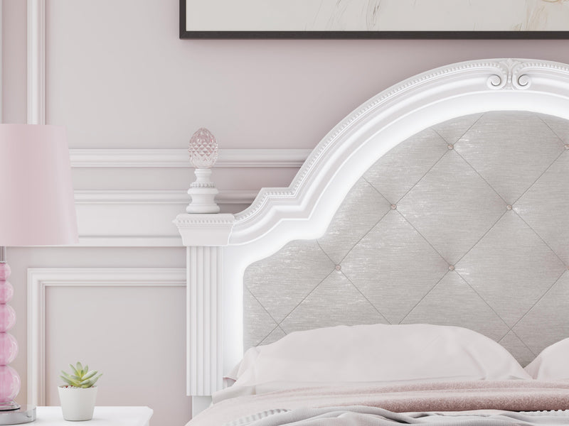 Ashley Furniture Kozlani upholstered bed with white fabric, showcasing a detailed headboard and elegant design.