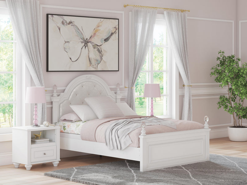 Ashley Furniture Kozlani upholstered bed with a padded headboard and neutral fabric, shown in a modern bedroom setting.