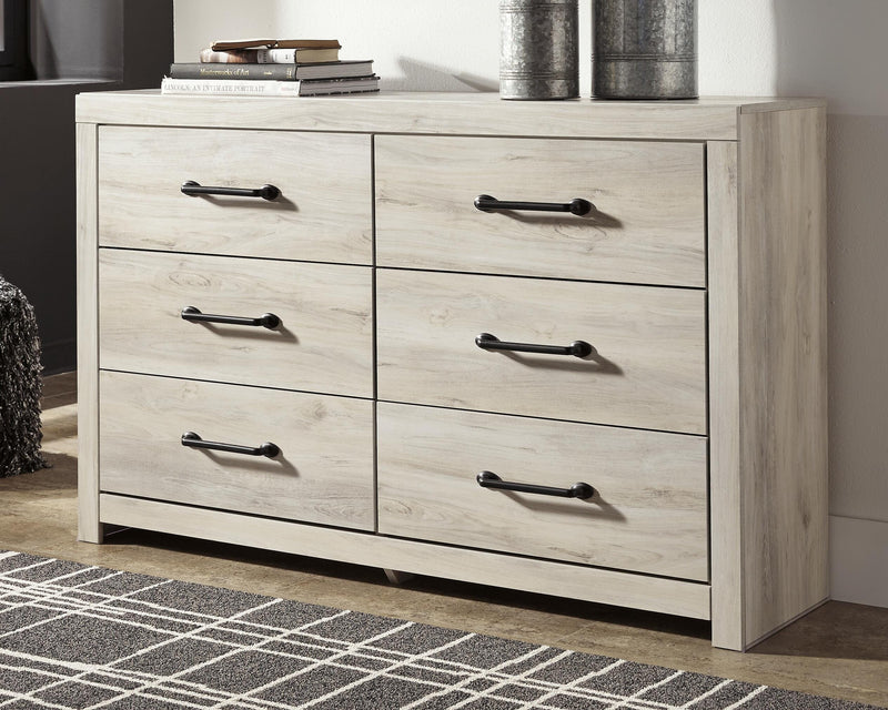 Ashley Furniture Cambeck Dresser with six drawers, dark wood finish, and modern design, shown in a close-up image.