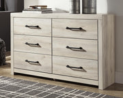 Ashley Furniture Cambeck dresser and mirror set with wood finish, featuring multiple drawers and a matching mirror for bedroom storage.