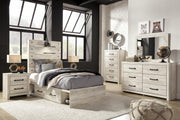 Ashley Furniture Cambeck bed with four storage drawers, sturdy wood frame, and classic design for bedroom organization.