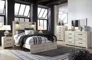 Ashley Furniture Cambeck dresser and mirror set, featuring a wooden dresser with a matching rectangular mirror.